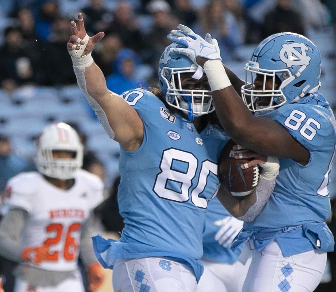 North Carolina’s Jake Bargas (80) celebrates after scoring a touchdown on a on a 44-yard pass completion from quarter back Sam Howell to give the Tar Heels’ a 28-0 lead in the second quarter on Saturday, November 23, 2019 at Kenan Stadium in Chapel Hill, N.C.