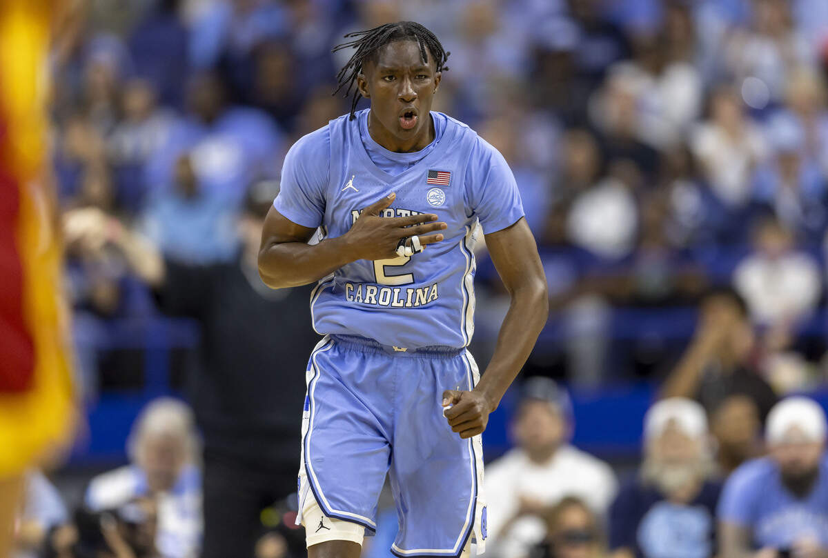 North Carolina guard Isaiah Denis reacts after sinking a basket to pull the Tar Heels to within one point of Southern California in the first half on Friday, Oct. 9, 2026 at the First Horizon Coliseum in Greensboro, N.C.