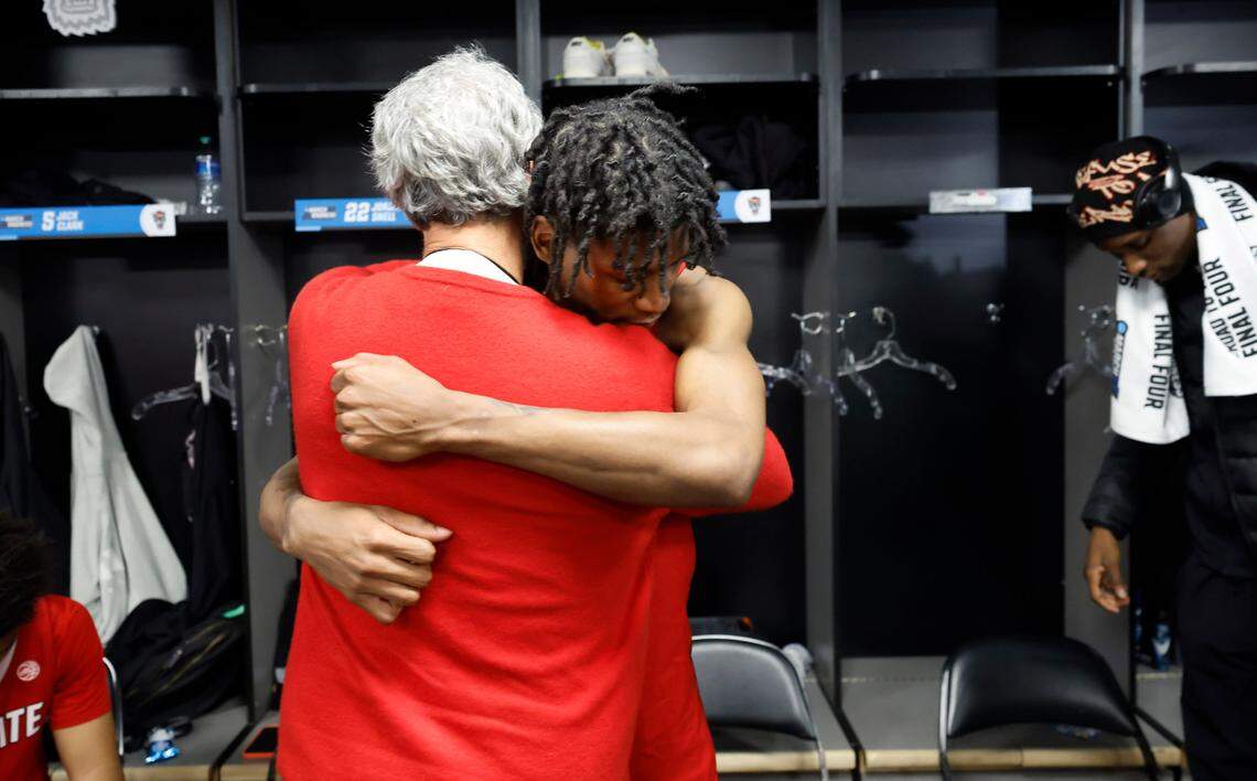 N.C. State athletics director Boo Corrigan hugs Terquavion Smith in the locker room after Creighton’s 72-63 victory over N.C. State in the first round of the NCAA Tournament at Ball Arena in Denver, Colo., Friday, March 17, 2023.