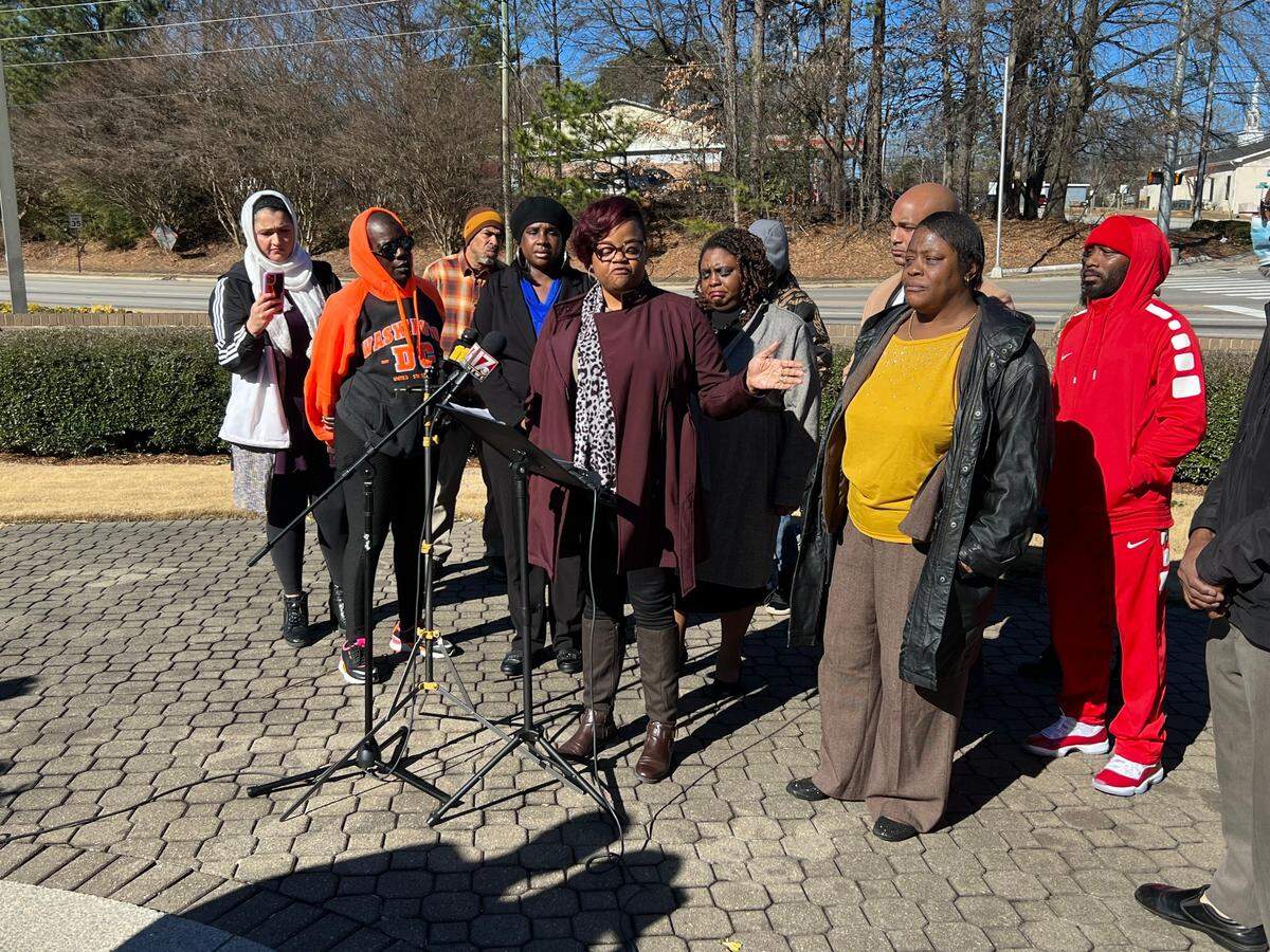 Sonya Williams (pictured to the right in yellow) was joined by local activists and supporters for a press conference after the death of her son, Darryl, on Jan. 17. The 32-year-old died after being tased by Raleigh Police officers.
