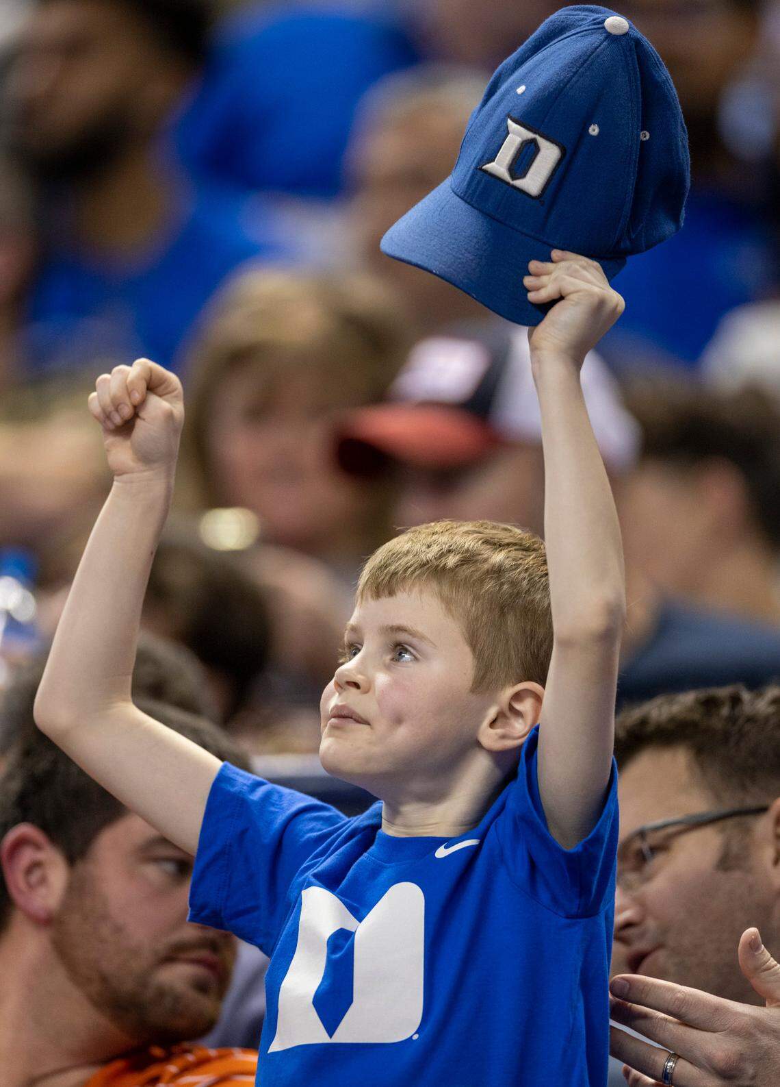 Eight-year-old Charlie Davis of Greensboro shows this support for the Duke Blue Devils during their game against Miami in the semi-finals of the ACC Tournament on Friday, March 10, 2023 at the Greensboro Coliseum in Greensboro, N.C.