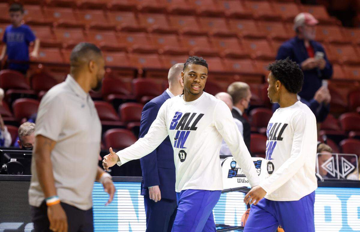 Duke’s Trevor Keels talks with Jeremy Roach as they come off the court after warming up before Duke’s game against Cal State Fullerton in the first round of the NCAA Tournament at Bon Secours Wellness Arena in Greenville, S.C., Friday, March 18, 2022.