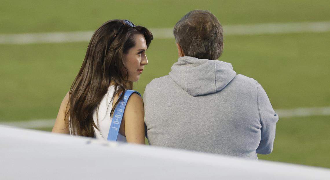Jordon Hudson talks to North Carolina head coach Bill Belichick as the team warms up before UNC’s game against TCU at Kenan Stadium in Chapel Hill, N.C., Monday, Sept. 1, 2025.
