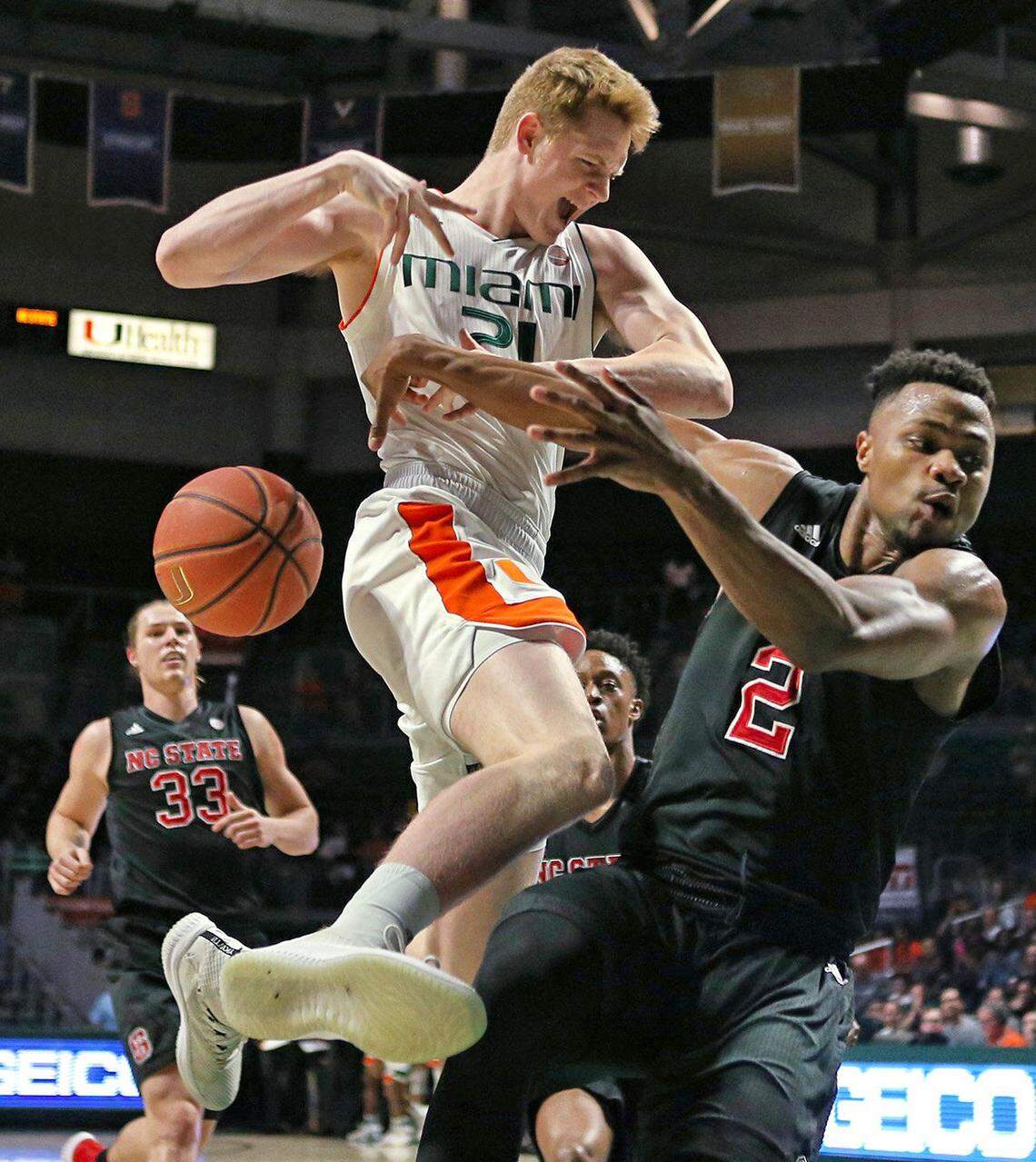 Miami’s Sam Waardenburg (21) loses control of the ball against North Carolina State’s Torin Dorn (2) during the first half at the Watsco Center in Coral Gables, Fla., on Thursday, Jan. 3, 2019. N.C. State won, 87-82.