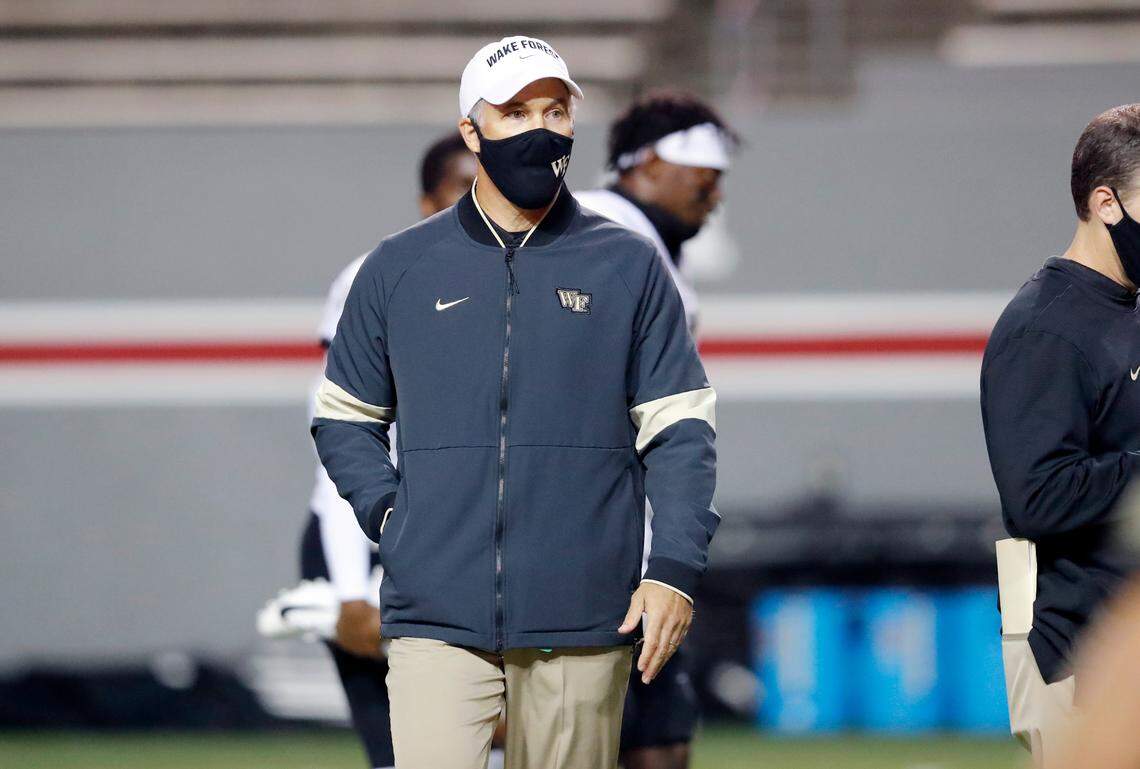 Wake Forest head coach Dave Clawson watches his team warm up before N.C. State’s game against Wake Forest at Carter-Finley Stadium in Raleigh, N.C, Saturday, Sept. 19, 2020.