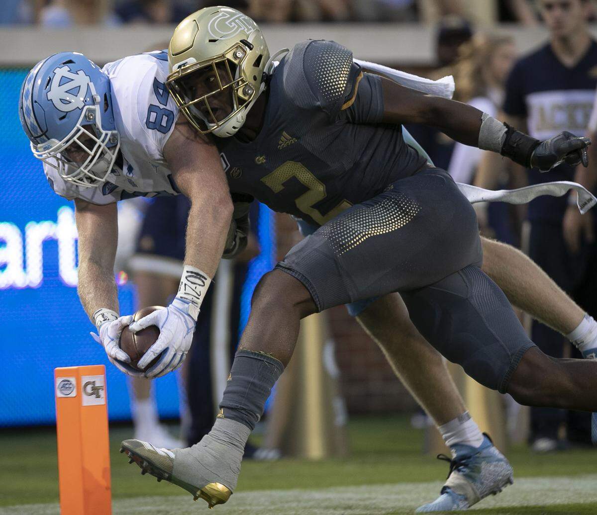 North Carolina Garrett Walston (84) scores on a 16 yard pass completion from quarterback Sam Howell ahead of Georgia Tech’s Tariq Carpenter (2) to give the Tar Heels a 31-15 lead in the fourth quarter on Saturday, October 5, at Bobby Dodd Stadium in Atlanta, Georgia.