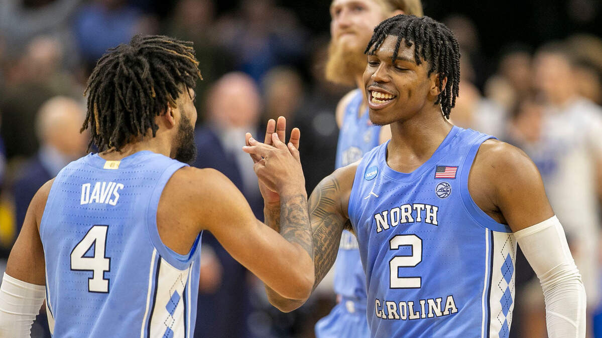 North Carolina’s Caleb Love (2) and R.J. Davis (4) react as they secure the Tar Heels’ 73-66 victory over UCLA on Friday, March 25, 2022 during the NCAA East Regional semi-final at Wells Fargo Center in Philadelphia, Pa.