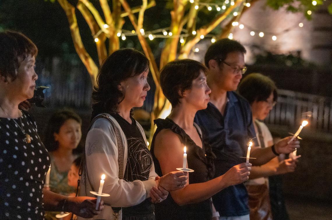 Members of the Asian-American community pay tribute to UNC-Chapel Hill professor Zijie Yan during a candlelight vigil organized by the Chinese American Friends Association of North Carolina and and North Carolina Asian Americans Together at the Cary Arts Center on Tuesday evening, Sept. 5, 2023. Yan was shot and killed on campus on Monday, Aug. 28.