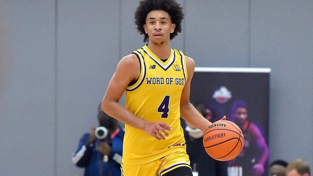 Word of God’s Freddie Dilione (4) (4) brings the ball downcourt to set up a play against Chambers during the first half. The Word of God Holy Rams and the Julius Chambers Cougars met in the John Wall Holiday Classic in Raleigh, N.C. on December 27, 2021