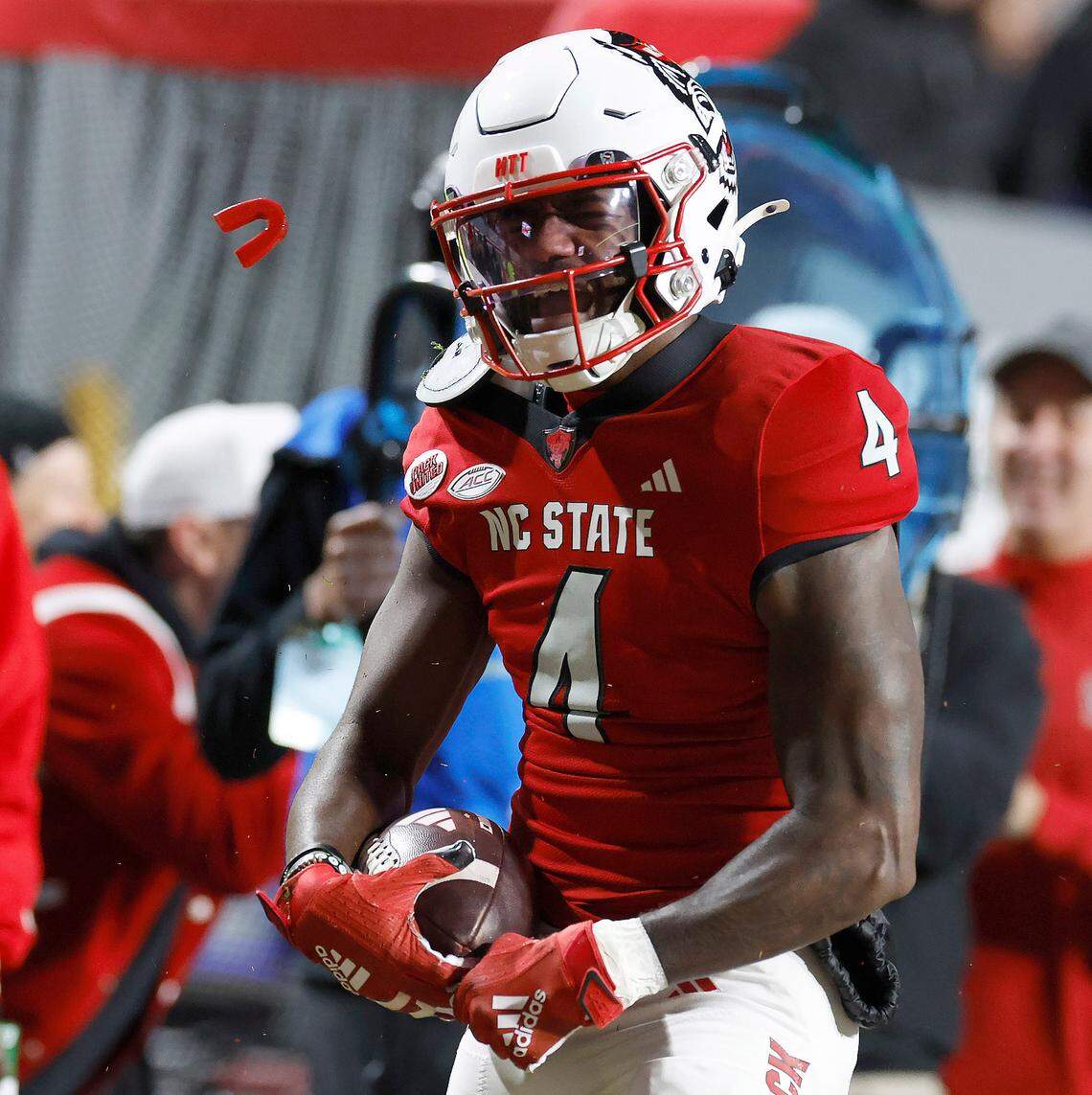 N.C. State wide receiver Porter Rooks (4) celebrates a long reception during the first half of N.C. State’s game against UNC at Carter-Finley Stadium in Raleigh, N.C., Saturday, Nov. 25, 2023.
