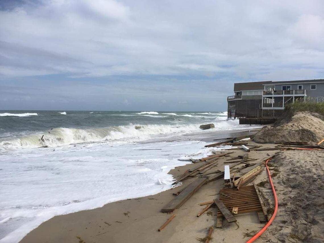 Debris from a Rodanthe house collapsing into the ocean is being tossed by waves back onto the beach.