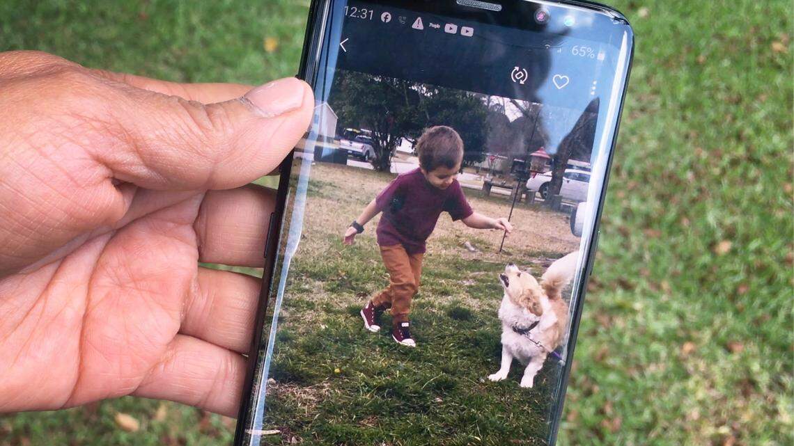 Consuela Groves shows a phone video of Cannon Hinnant, 5, who often played in her yard. Hinnant was shot while sitting on his bike in his yard in Wilson, N.C. and died.