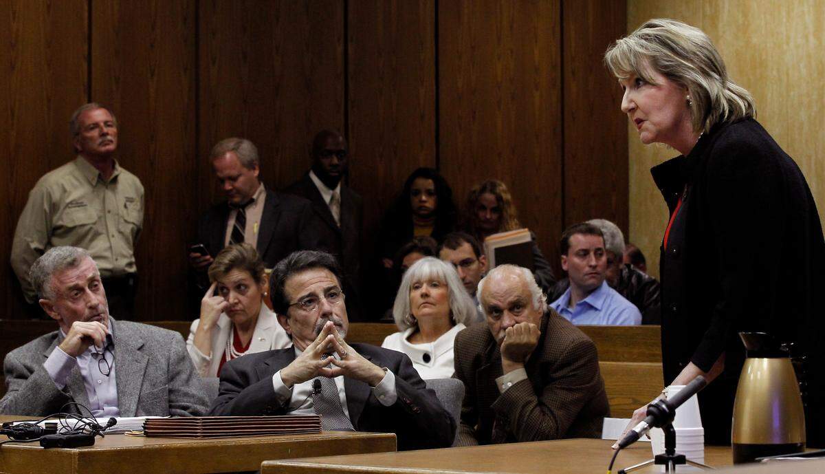 Kathleen Peterson’s sister, Candace Zamperini , makes an emotional appeal to Judge Orlando Hudson to continue the hearing saying Durham District Attorney Tracy Cline was unprepared. Saying the tenth anniversary of her sistera’s murder was just days away, Zamperini forcefully argued for more time, staring intently at Michael Peterson as she addressed the judge. Peterson and his legal team began their attack on former State Bureau of Investigation agent Duane Deaver, a key expert witness at Peterson’s 2003 trial, which ended in a life sentence for first-degree murder. A jury convicted Peterson of killing his wife, Nortel Networks executive Kathleen Peterson, who died in a pool of blood at the bottom of a blood-spattered staircase in the Petersons’ Forest Hills mansion in December 2001.