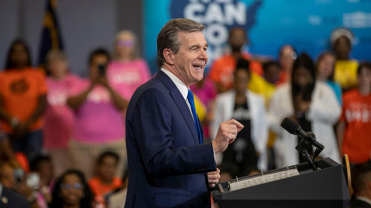 North Carolina Governor Roy Cooper touts the importance of getting the COVID-19 vaccine as he speaks before President Joe Biden at Green Road Community Center on Thursday, June 24, 2021 in Raleigh, N.C.