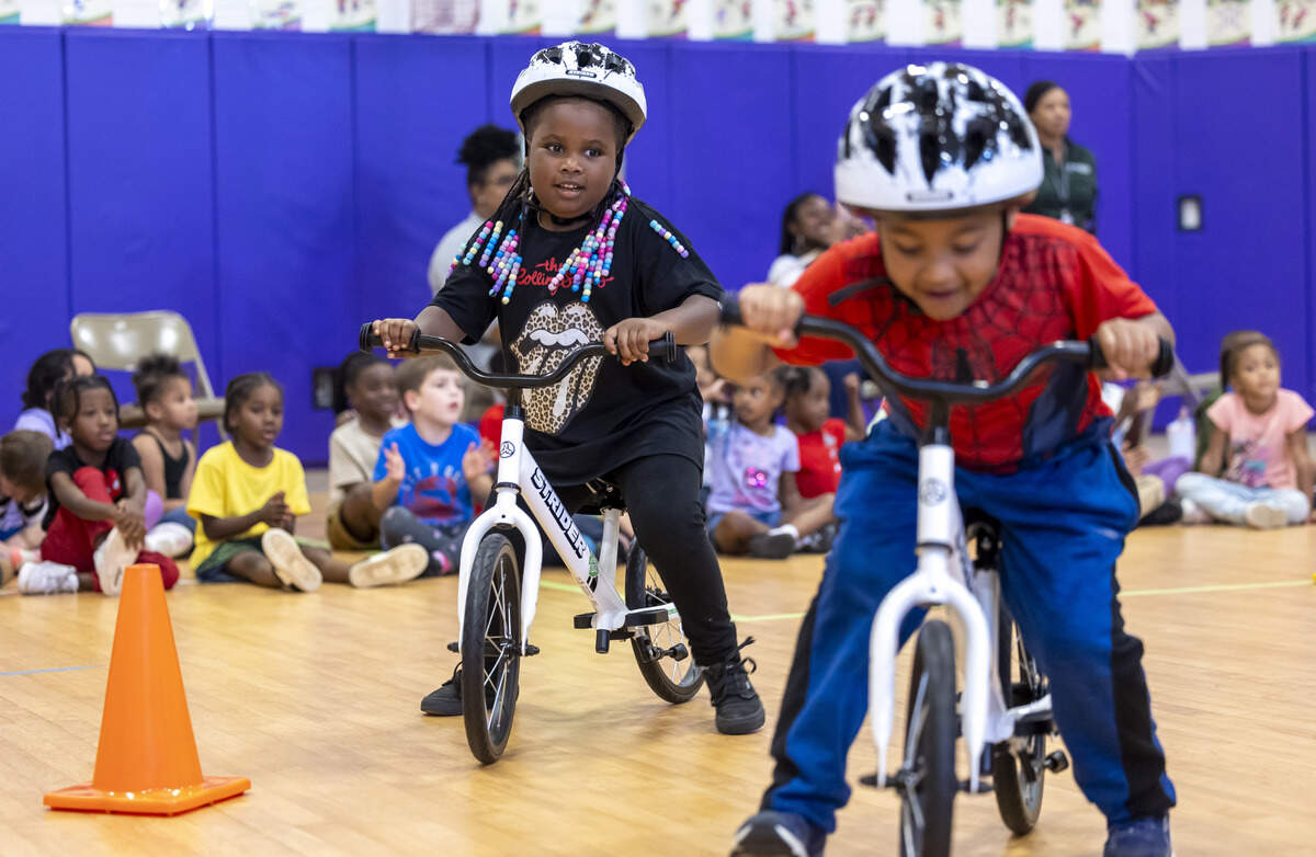 Green Magnet Elementary School kindergarten student Amari Jones tries out one of the new bikes donated to the school by the Life Time Foundation, on Thursday, September 25, 2025 in Raleigh, N.C.