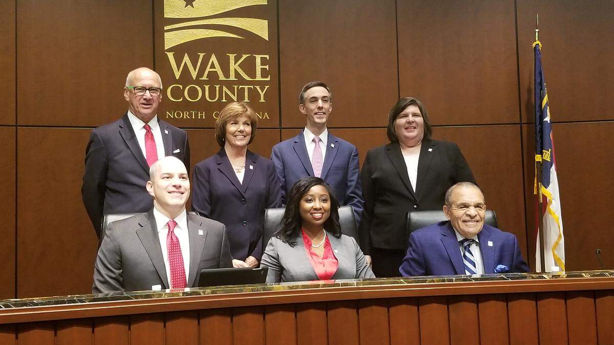 The Wake County Board of Commissioners sworn in on Dec. 3, 2018. Back, from left to right, Sig Hutchinson, Susan Evans, Matt Calabria and Vickie Adamson. Front, from left to right, Greg Ford, Jessica Holmes and James West.