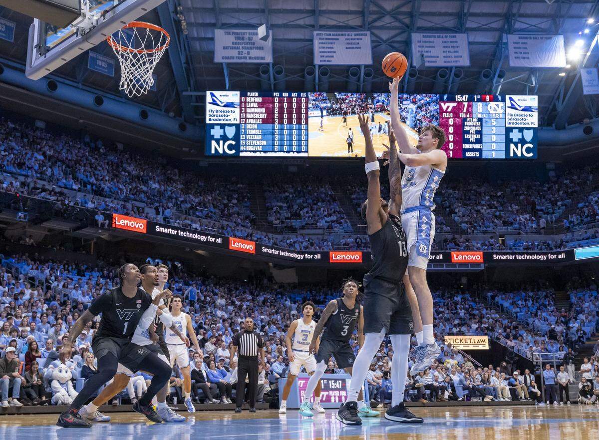 North Carolina center Henri Veesaar (13) puts up a shot against Virginia Tech forward Amani Hansberry (13) in the first half on Saturday, February 28, 2026 at the Smith Center in Chapel Hill, N.C.  Veesaar lead all scores with 26 points. 
