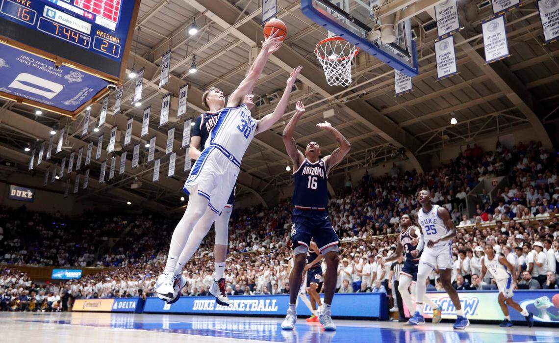 Duke’s Kyle Filipowski (30) heads to the basket as Arizona’s Motiejus Krivas (14) defends during Arizona’s 78-73 victory over Duke at Cameron Indoor Stadium in Durham, N.C., Friday, Nov. 10, 2023.