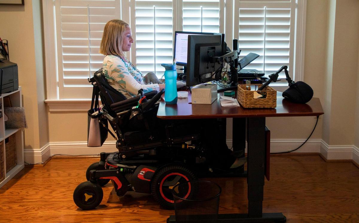 Seen here working at her desk, Ali Ingersoll who is paralyzed from the neck down and has been denied insurance coverage by Blue Cross Blue Shield of North Carolina for a specific piece of wheelchair equipment she believes to be medically necessary, and only until sharing her story publicly and now advocating for other people with disabilities facing the same battles with insurance, was her appeal accepted and the equipment ordered, on Tuesday, July 7, 2020, in Raleigh, N.C.