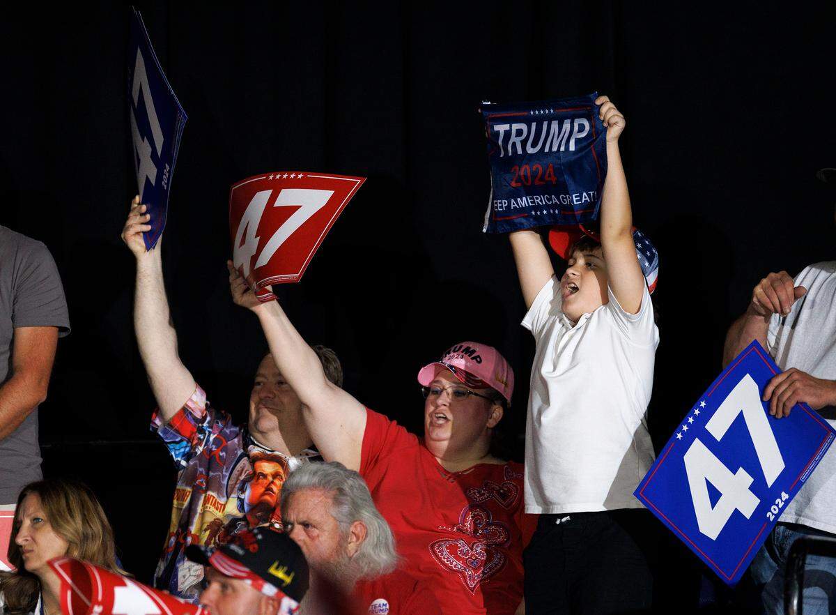Supporters of former President and Republican presidential candidate Donald Trump cheer during his remarks at a campaign rally at the Greensboro Coliseum Complex on Tuesday, Oct. 22, 2024, in Greensboro, N.C.