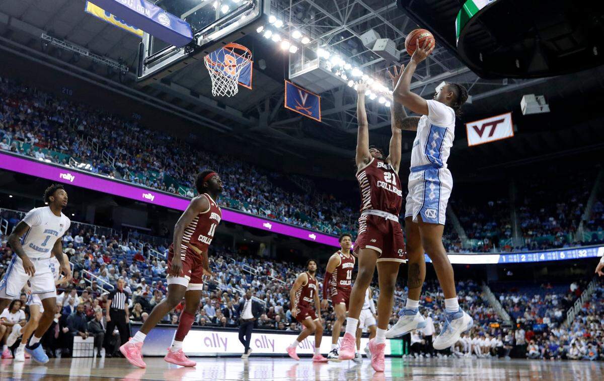 North Carolina’s Armando Bacot (5) shoots as Boston College’s Devin McGlockton (21) defends during the first half of UNC’s game against Boston College in the second round of the New York Life ACC Men’s Basketball Tournament in Greensboro, N.C., Wednesday, March 8, 2023.