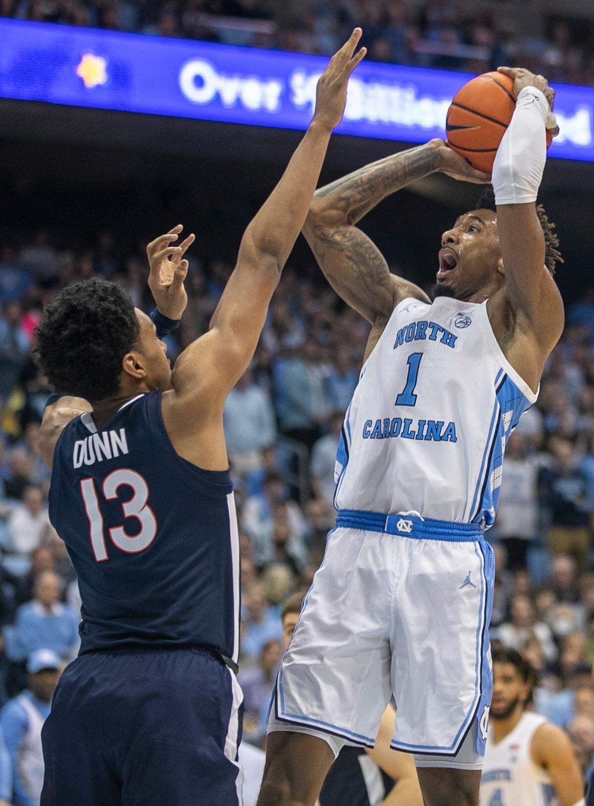 North Carolina’s Leaky Black (1) put up a shot against Virginia’s Ben Ryan Dunn (13) in the second half on Saturday, February 25, 2023 at the Smith Center in Chapel Hill, N.C.