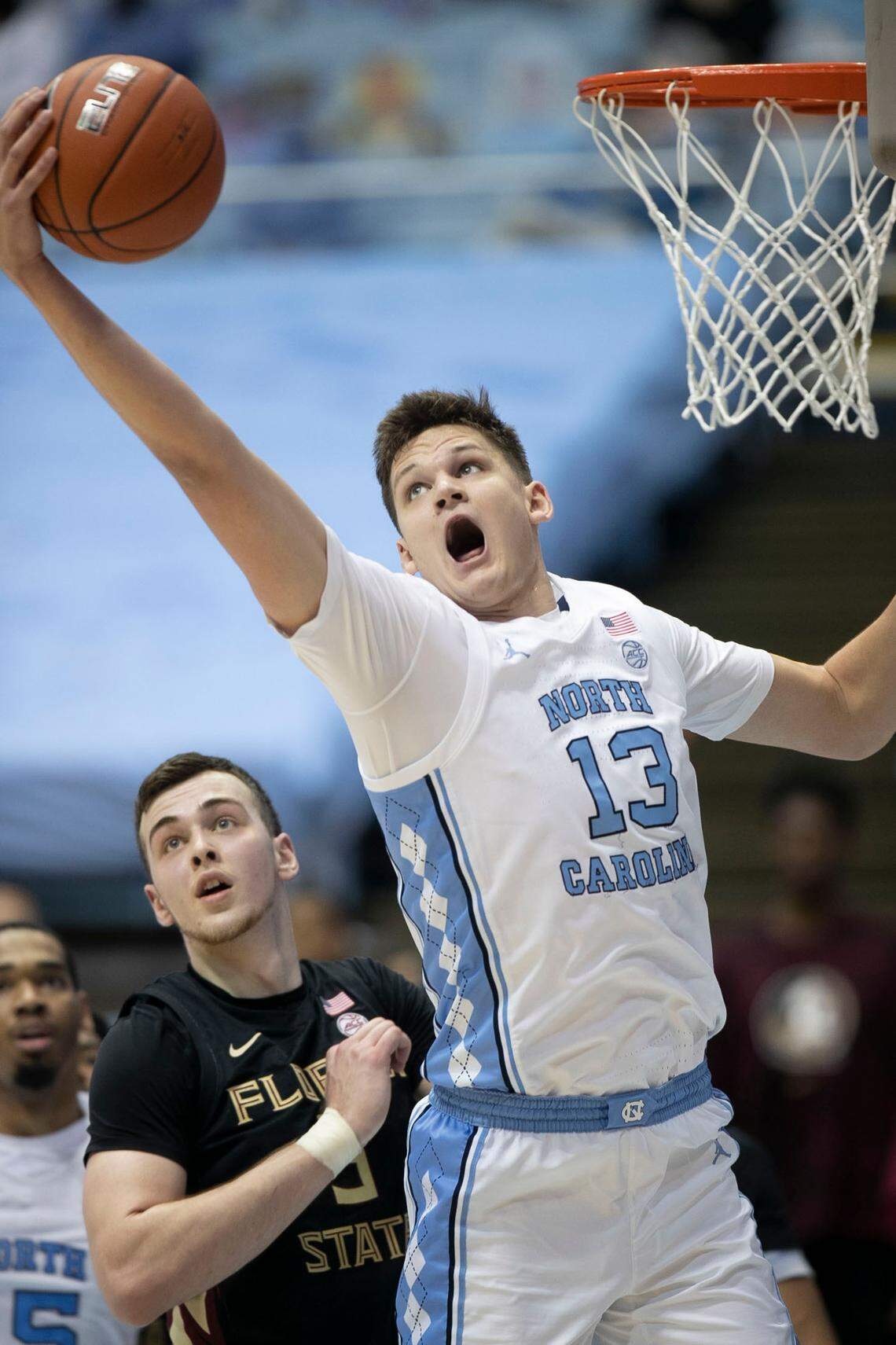 North Carolina’s Walker Kessler (13) secures an offensive rebound over Florida State’s Balsa Koprivica (5) during the first half on Saturday, February 27, 2021 in Chapel Hill, N.C.