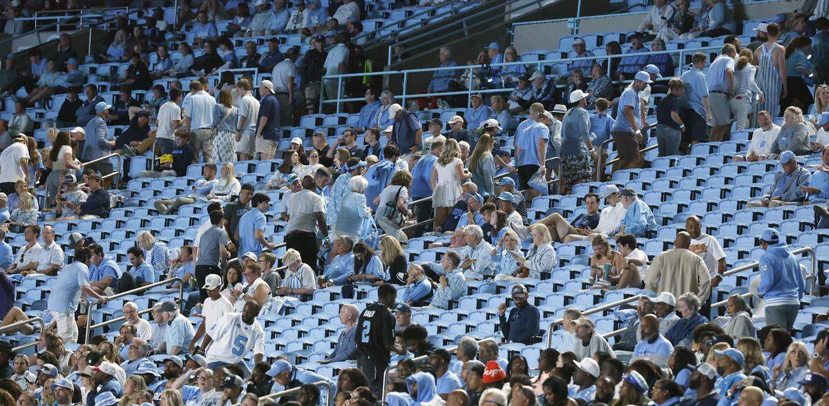 Fans leave the stadium early in the fourth quarter during UNC’s game against TCU at Kenan Stadium in Chapel Hill, N.C., Monday, Sept. 1, 2025.