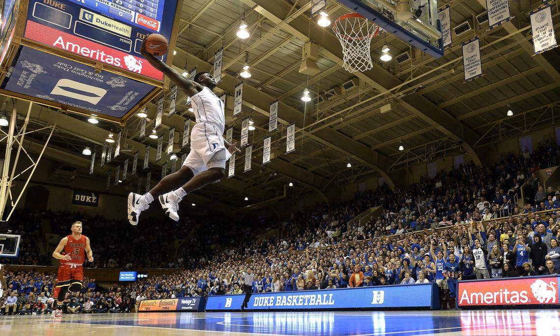 Duke’s Zion Williamson forward (1) goes in for a breakaway dunk in the first half of play as Ferris State Greg Williams (15) looks on. Duke played an exhibition against Ferris State at Cameron Indoor Stadium In Durham, N.C. Saturday, October 27, 2018.