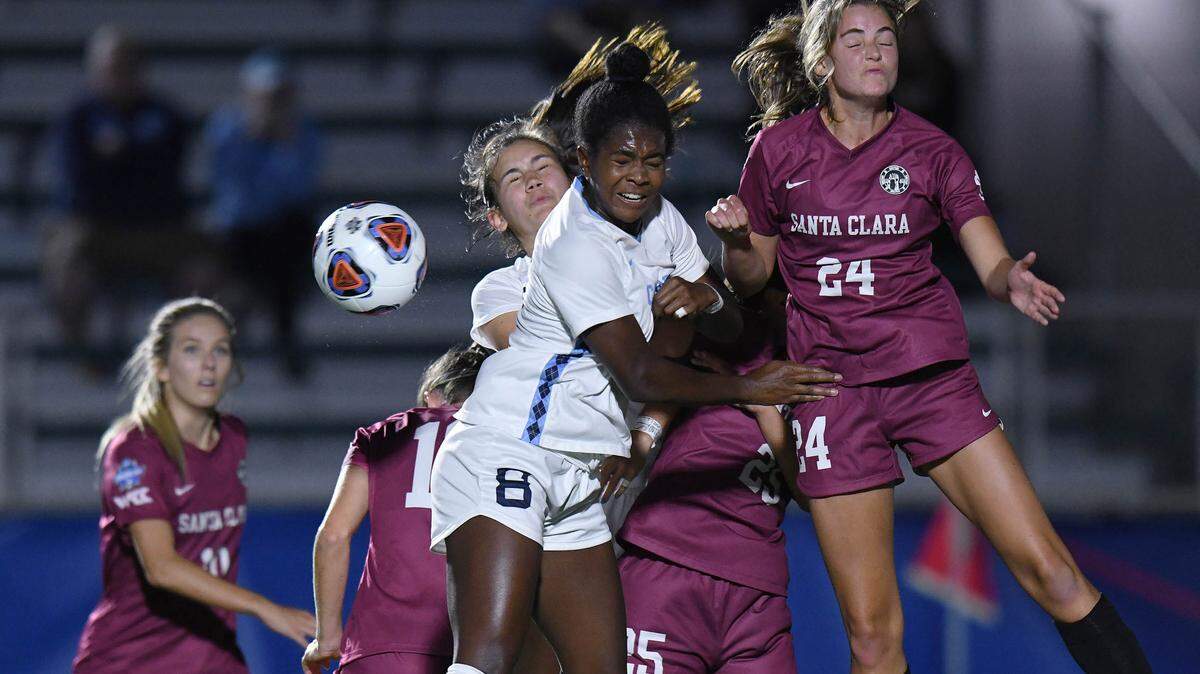 UNC’s Brianna Pinto goes for a header against a pack of Santa Clara defenders in the College Cup semifinals at WakeMed Soccer Park on Thursday, May 13 in Cary, N.C.