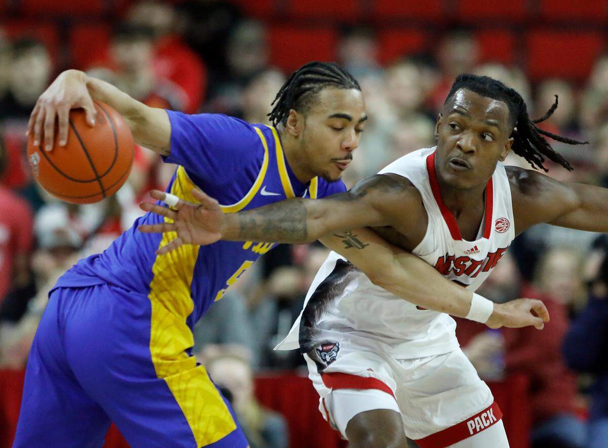 N.C. State’s DJ Horne pressures Pittsburgh’s Ishmael Leggett during the first half of the Wolfpack’s 67-64 loss on Wednesday, Feb. 7, 2024, at PNC Arena in Raleigh, N.C.