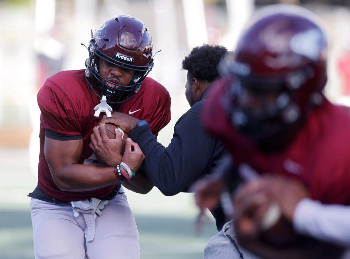 North Carolina Central’s Latrell Collier, left, runs a drill during practice at O’Kelly-Riddick Stadium on Tuesday, Oct. 18, 2022, in Durham, N.C.