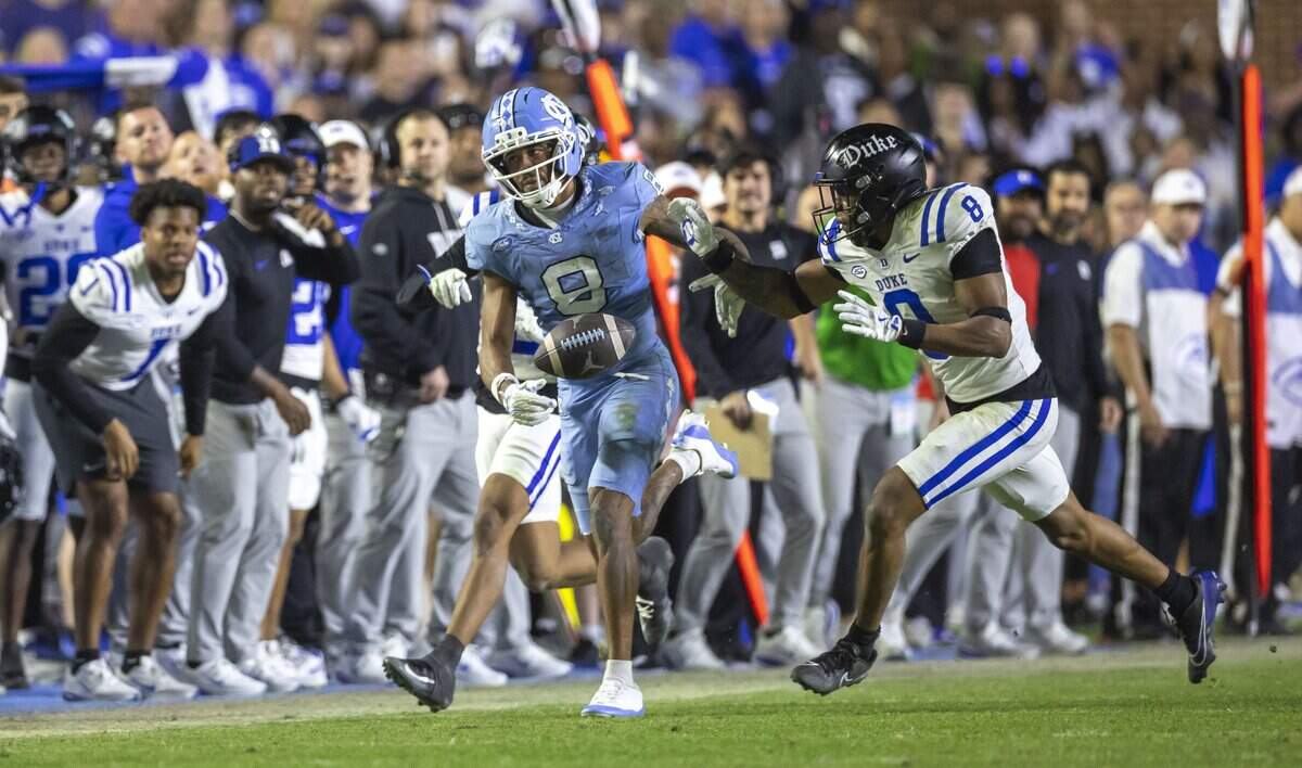 North Carolina wide receiver Kobe Paysour (8) can’t pull in a pass from quarterback Gio Lopez on fourth down, with 1:22 to play in the game, to secure a 32-25 victory for Duke on Saturday, November 22, 2025 at Kenan Stadium in Chapel Hill, N.C.