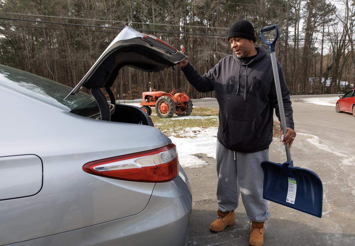 With snow in the weekend forecast, some in the Triangle are using Friday, Jan. 30 to prepare. Earle Whitsett loads a shovel into his vehicle after purchasing supplies at Woods Farm & Garden in Hillsborough.