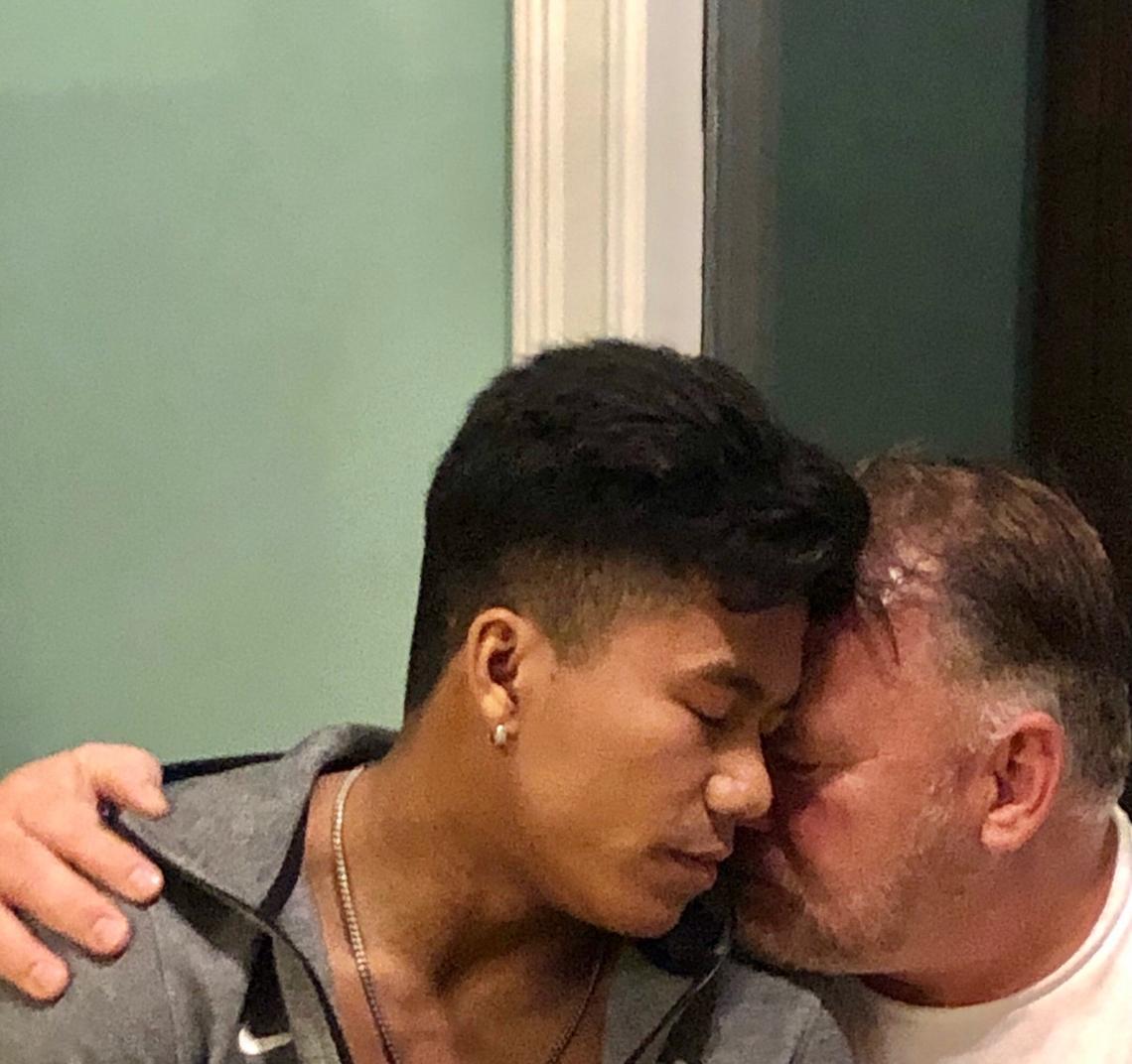 Jordan Windle (left) and his father Jerry Windle (right) hug during their first encounter after the Olympic trials in Indianapolis on June 13, 2021.