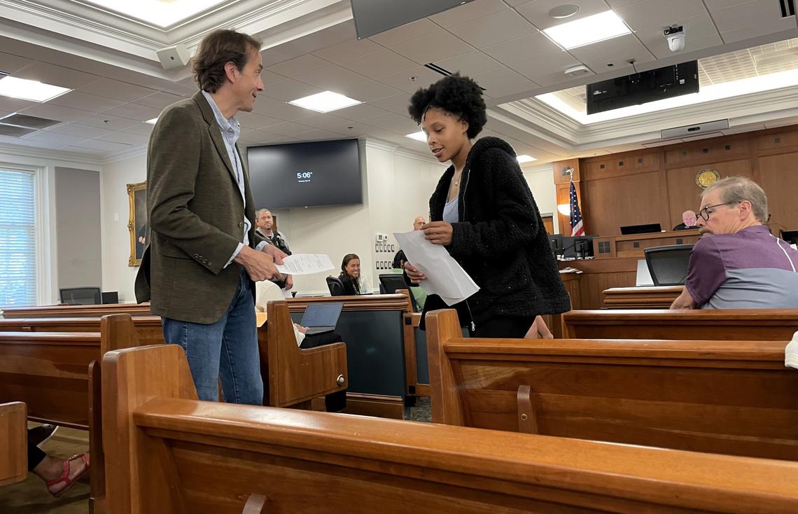 Diamond Brown talks with an attorney, who was called to Orange County Superior Court at the end of the day Thursday to advise her. Brown was key to solving the Home Depot robbery that led to Gary Rasor’s death in HIllsborough, police said.