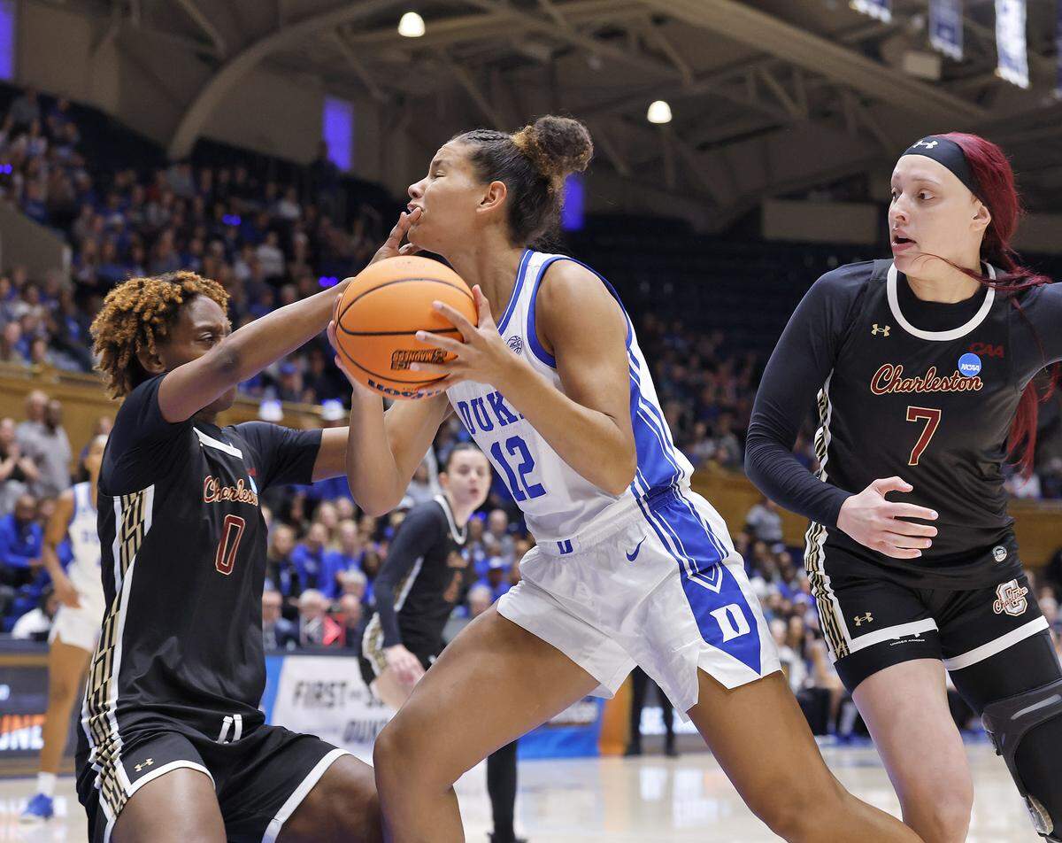 Duke’s Delaney Thomas is fouled by College of Charleston’s Taylor Barbot during the first half of the Blue Devils’ first-round NCAA Tournament game on Friday, March 20, 2026, at Cameron Indoor Stadium in Durham, N.C.