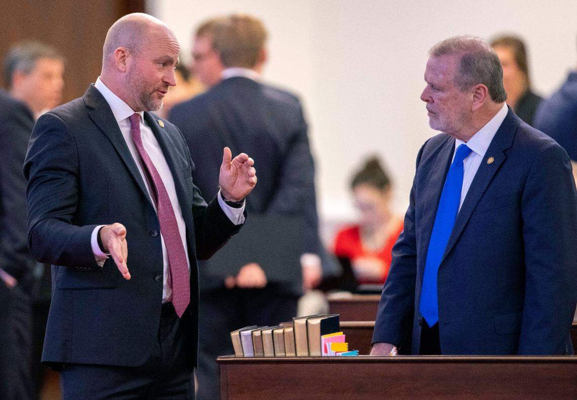 Senator Danny Britt, who represents Columbus and Robeson Counties talks with Senate President Pro Tempore Phil Berger before a vote on the state budget on Wednesday, November 17, 2021 in Raleigh, N.C.
