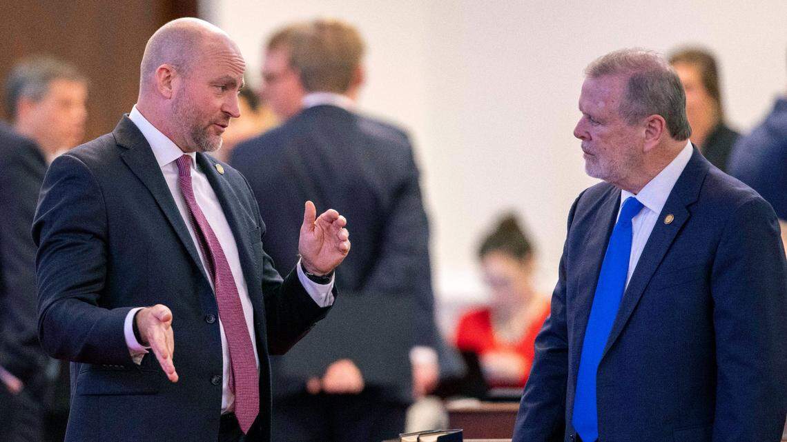 Senator Danny Britt, who represents Columbus and Robeson Counties talks with Senate President Pro Tempore Phil Berger before a vote on the state budget on Wednesday, November 17, 2021 in Raleigh, N.C.