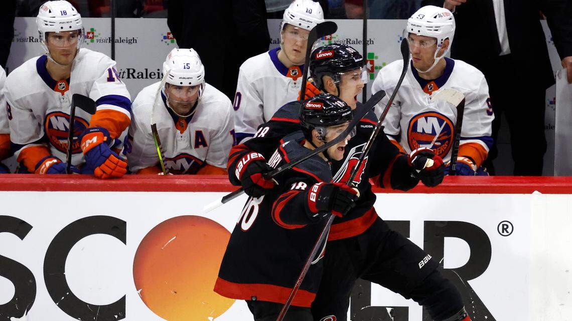 Carolina’s Martin Necas (88) and Jack Drury (18) celebrate after Necas scored on an empty netter during the third period of the Hurricanes 3-1 victory over the Islanders in the first round of the Stanley Cup playoffs at PNC Arena in Raleigh, N.C., Saturday, April 20, 2024.