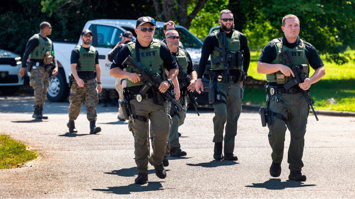 Officers with the North Carolina Prison Emergency Response Team (PERT) search for escaped inmate Ramone Alston on Wednesday morning August 14, 2024 in Hillsborough, N.C. Alston, who was serving a life sentence for second degree murder, escaped on Tuesday morning at UNC Hospitals in Hillsborough as he was being transported from Bertie Correctional Institute to Hillsborough.