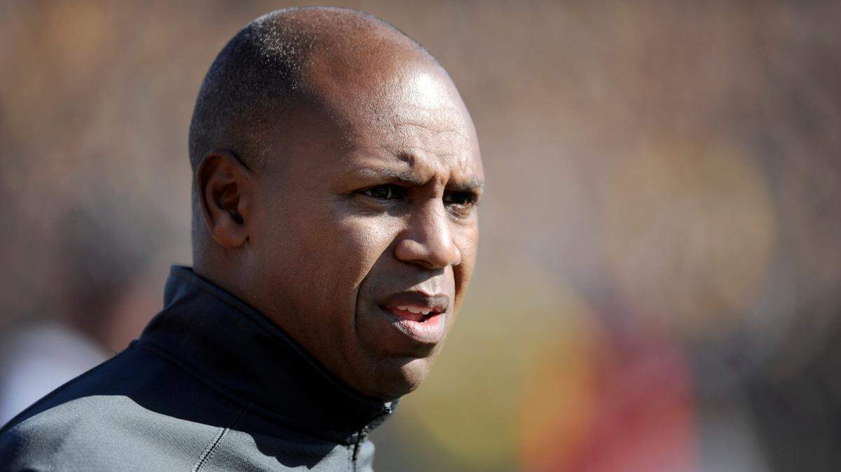 In this 2012 file photo, Kentucky head coach Joker Phillips stands on the sidelines during the first half of an NCAA college football game against Missouri Saturday, Oct. 27, 2012, in Columbia, Mo.
