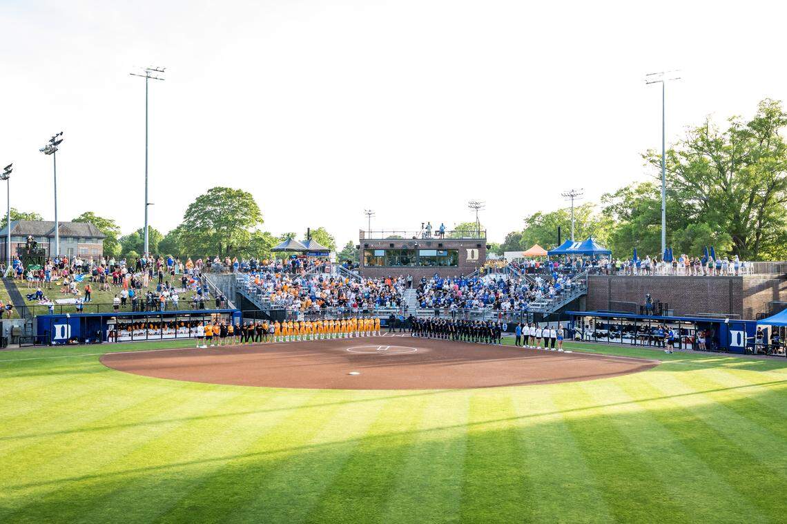 The Duke and Tennessee softball teams stand for the national anthem before the nonconference game on April 15 at Smith Family Stadium in Durham, North Carolina.