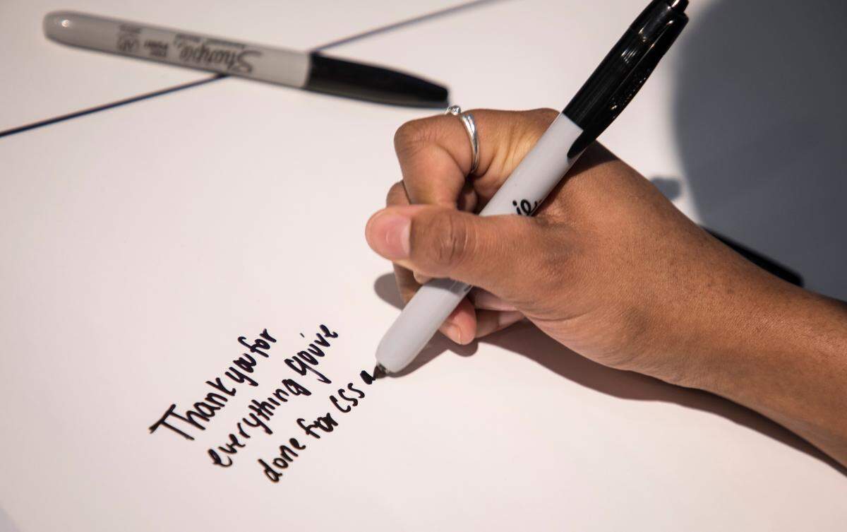 UNC-Chapel Hill student Najla Ward-Conyers, a freshman from Charlotte, writes a note to Carol Folt in the student union on Tuesday, Jan. 29, 2019.
