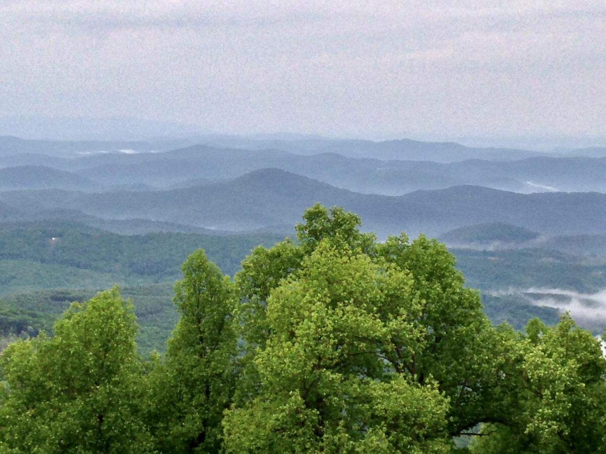 A view of Ashe County from the Blue Ridge Parkway shows the mountain range living up to its name. Funds from the nonprofit Blue Ridge Parkway Foundation have helped keep facilities open along the scenic roadway open a historically long federal government shutdown that began Oct. 1, 2025.