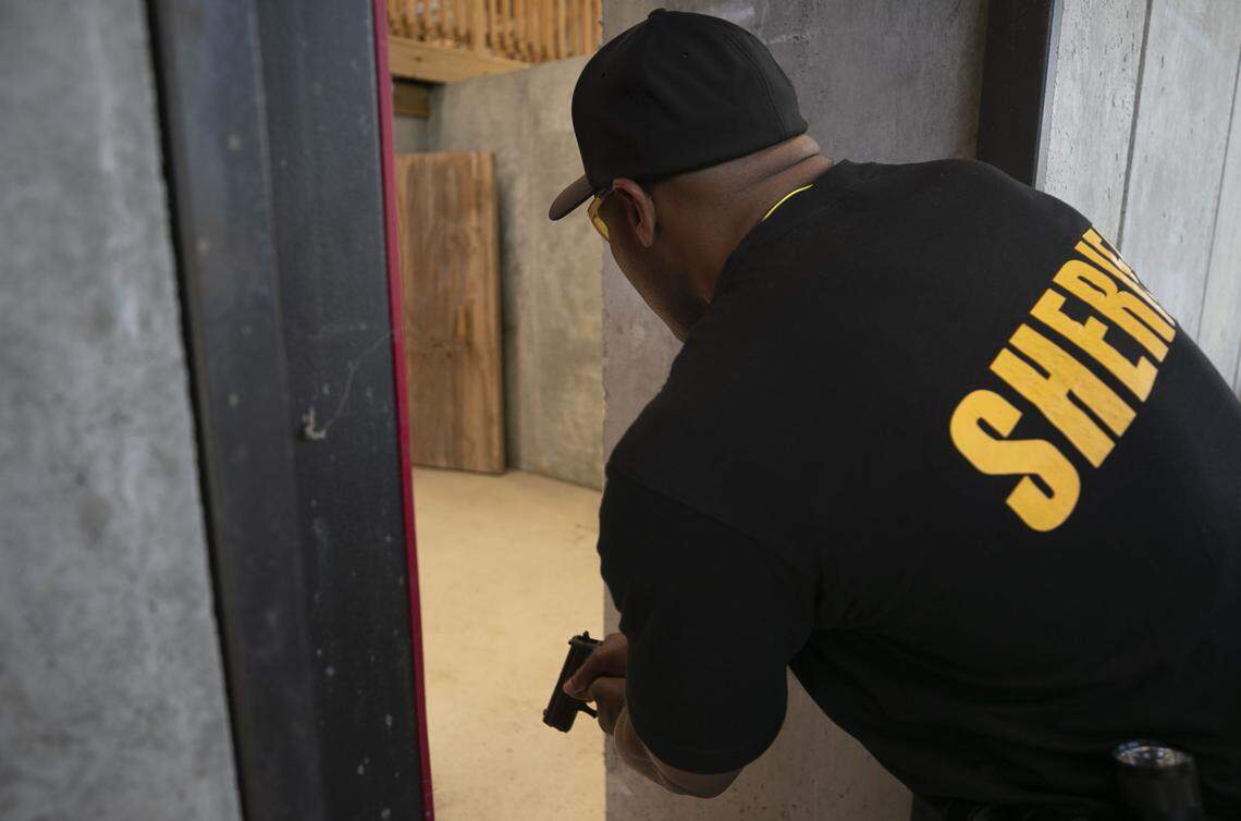 Wake County deputy W.D. Washington, a school resource officer at Wake Forest Middle School, enters a shoot house using rubber bullets, in a training exercise to simulate the response to an active shooter scenario at Howell Woods Environmental Learning Center near Four Oaks, N.C. on Thursday, August 8, 2019.