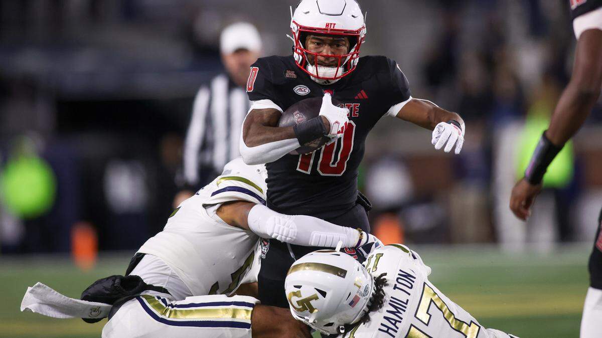 North Carolina State Wolfpack wide receiver Kevin Concepcion (10) runs the ball against the Georgia Tech Yellow Jackets in the first quarter at Bobby Dodd Stadium at Hyundai Field.