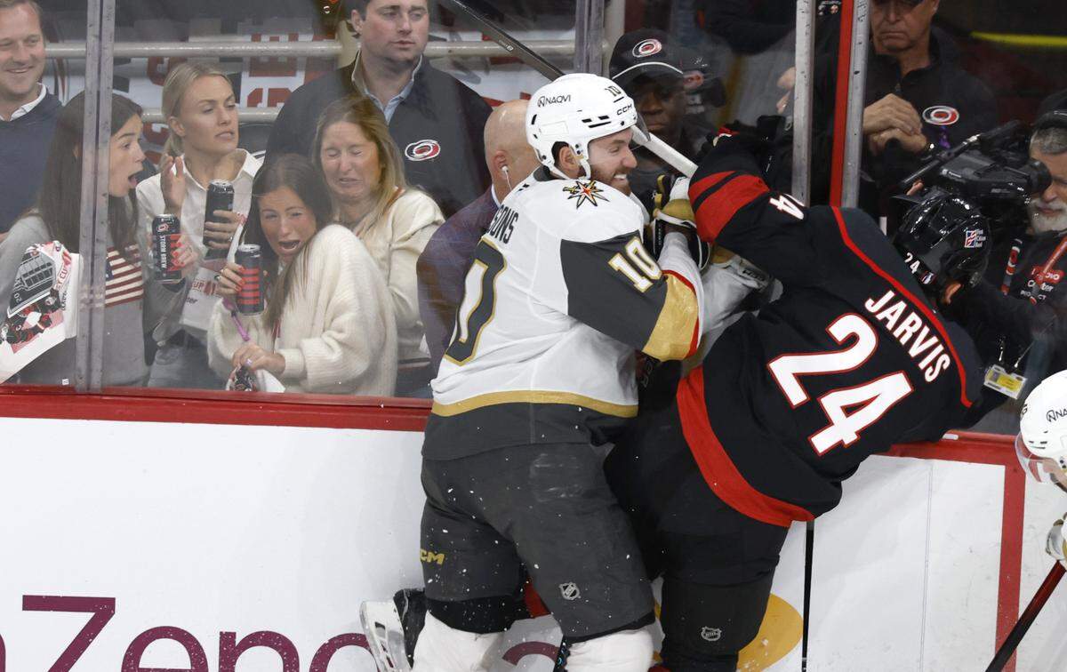 Vegas’ Colton Sissons (10) checks Carolina's Seth Jarvis (24) during the first period of the Hurricanes’ game against the Golden Knights in the first game of the Stanley Cup Final at the Lenovo Center in Raleigh, N.C., Tuesday, June 2, 2026.