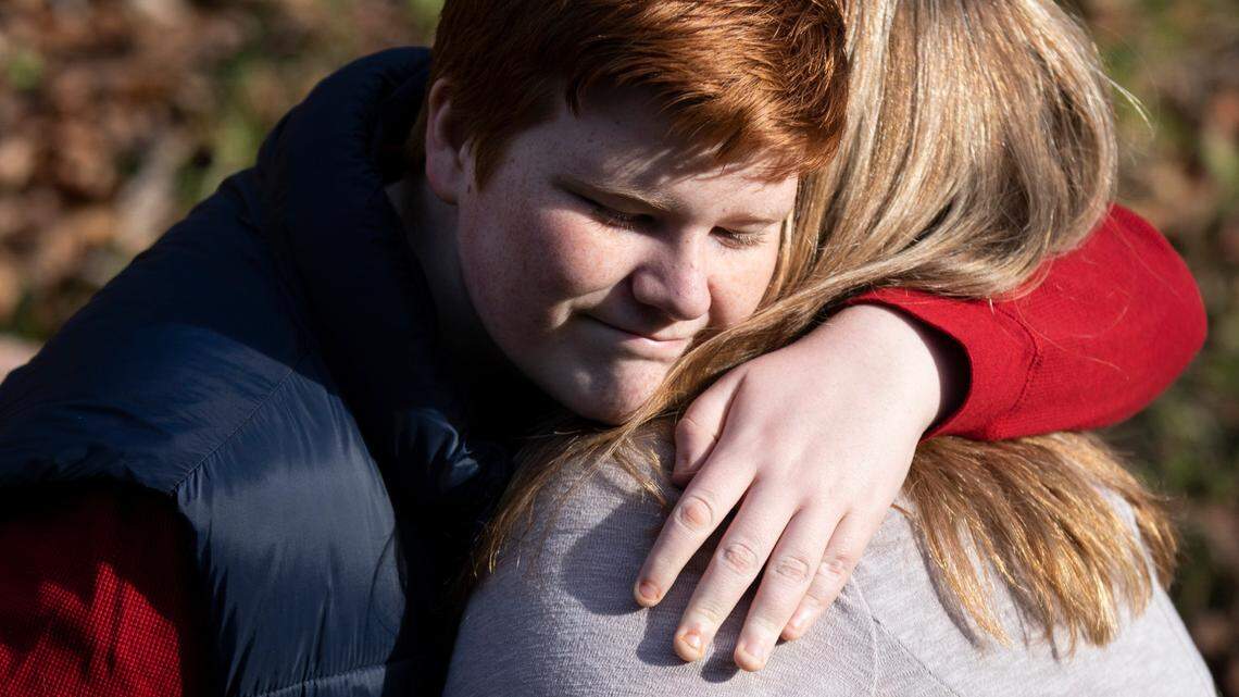 Quinn Wilson, 13, hugs his mother, Lindsay Wilson, outside their home in Newland. Quinn spent a terrifying seven days at Strategic Behavioral Health in Garner at age 10 when he struggled with aggression and depression. On Dec. 17, 2021 the facility agreed to close after the state found serious care issues.