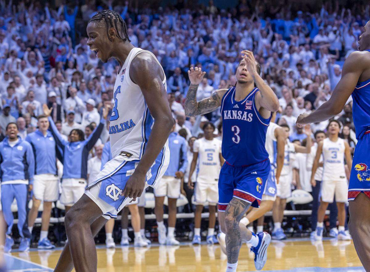 North Carolina forward Caleb Wilson (8) reacts after scoring his 24th point, sealing the Tar Heels’ 87-74 victory over Kansas with a dunk, on Friday, November 7, 2025 at the Smith Center in Chapel Hill, N.C.